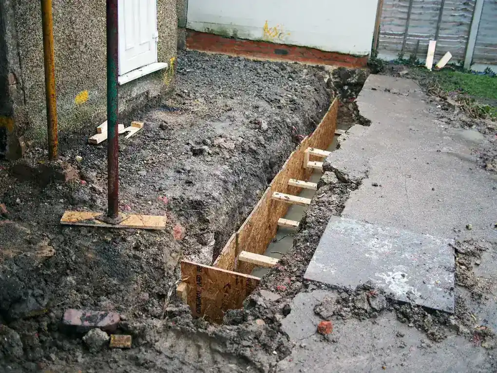 Florida contractor performing basement waterproofing construction work