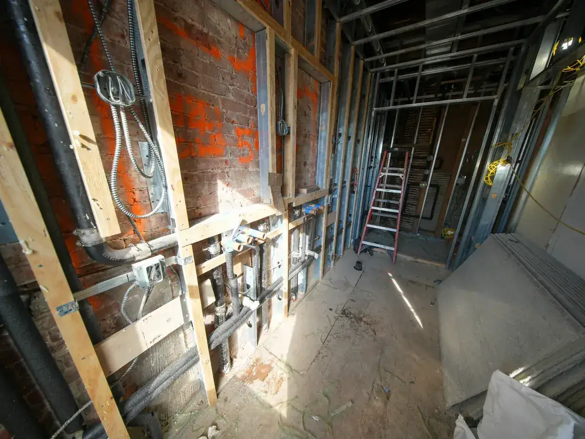 IWD Miami estimator performing on-site assessment for basement waterproofing project