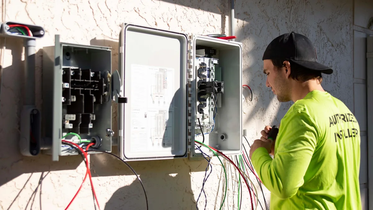 IWD Miami estimator performing on-site assessment for panel upgrades project