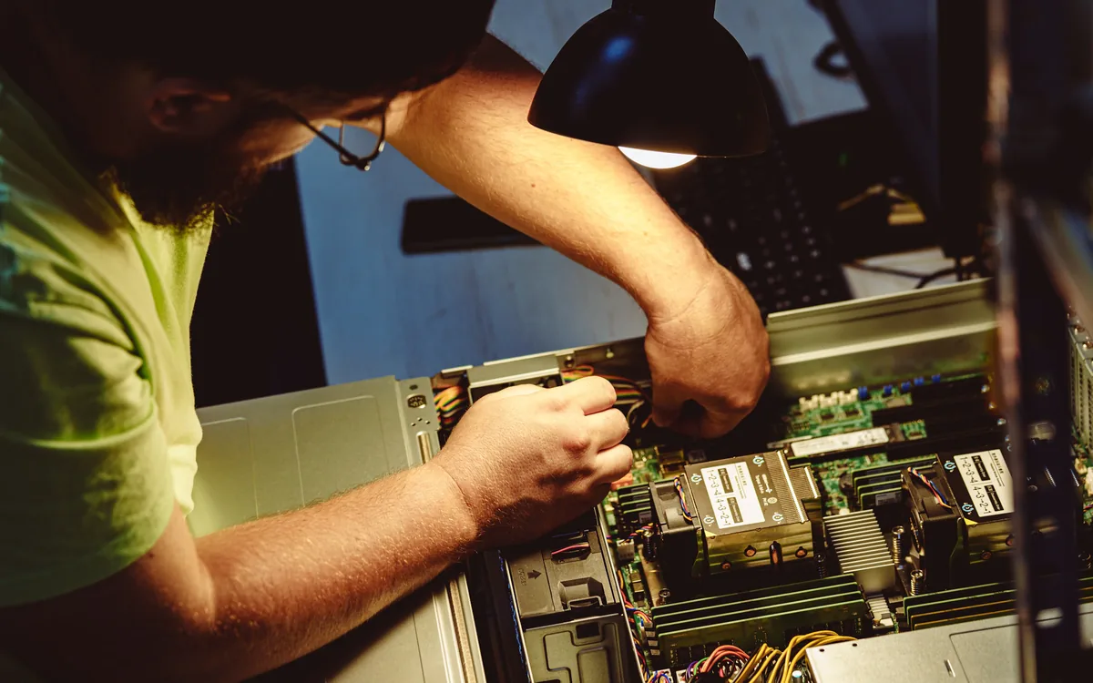 HVAC technician installing an outdoor high-efficiency heat pump unit