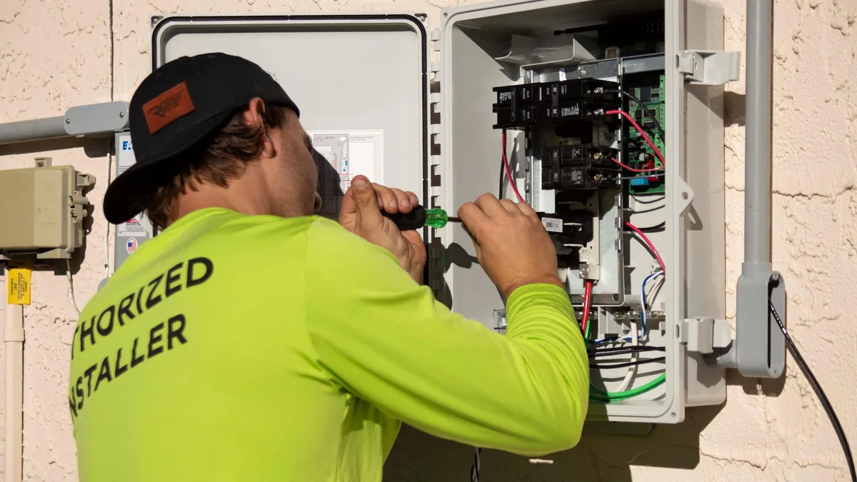 IWD Miami estimator performing on-site assessment for tankless water heater project