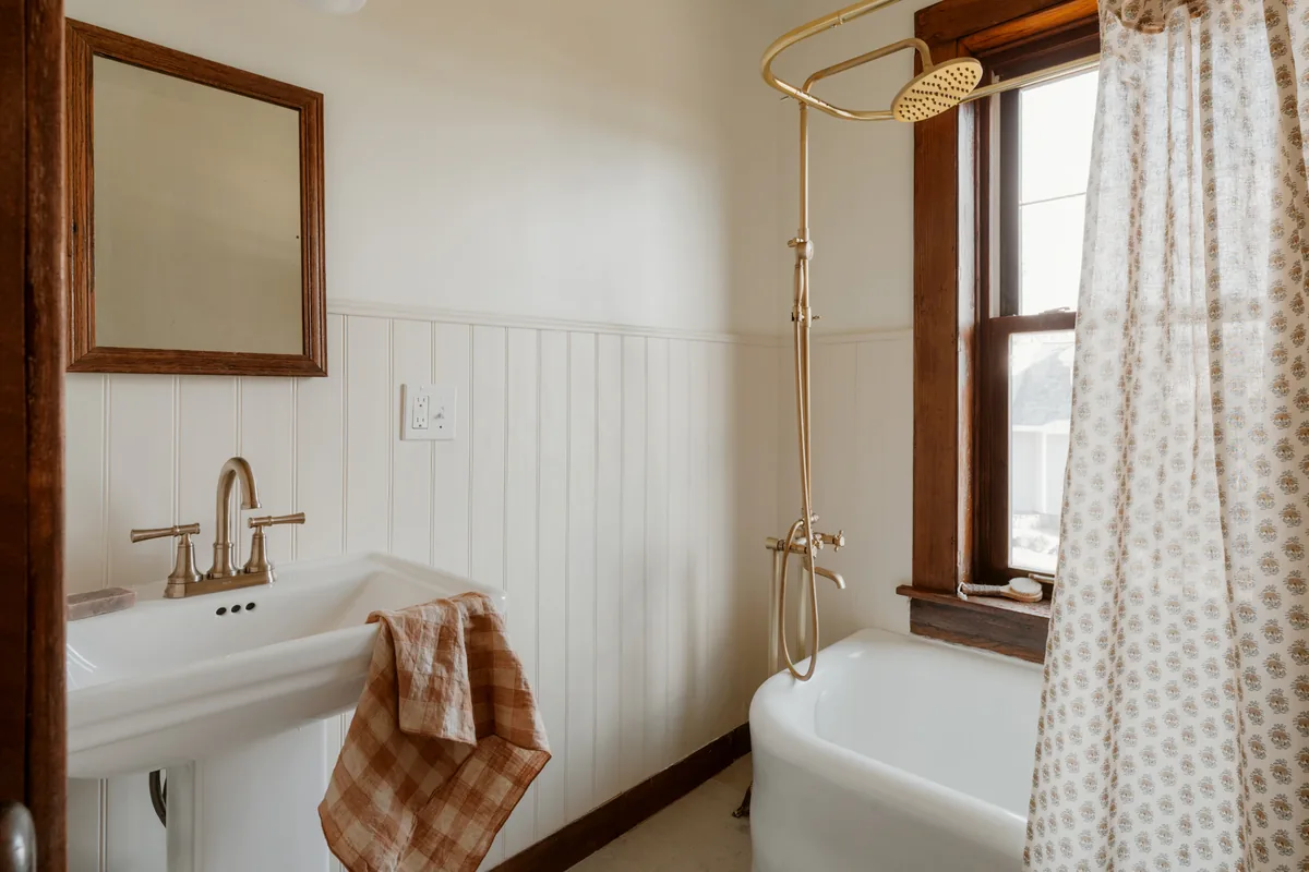 Master plumber installing bathroom plumbing equipment in a Florida home