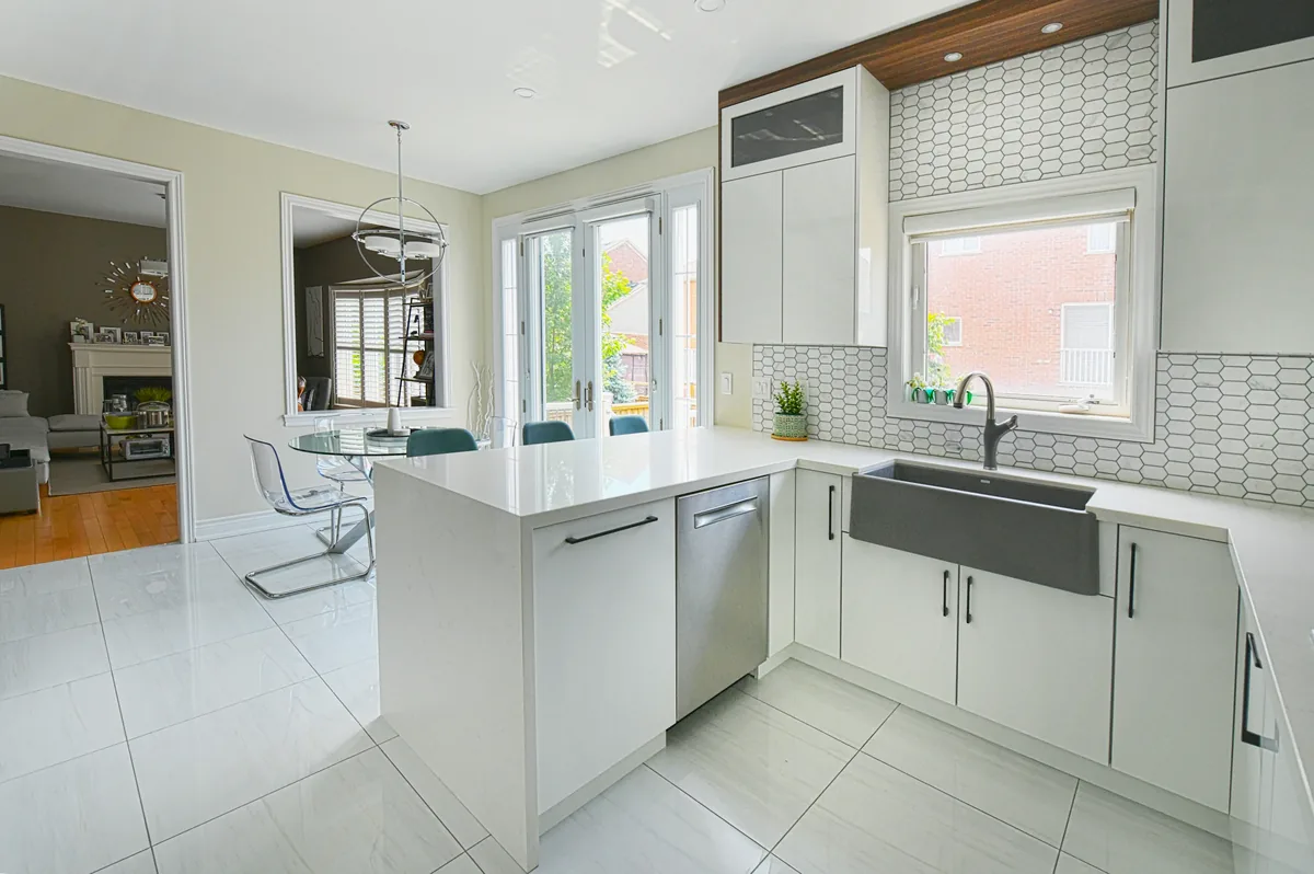IWD Miami estimator performing on-site assessment for kitchen plumbing project