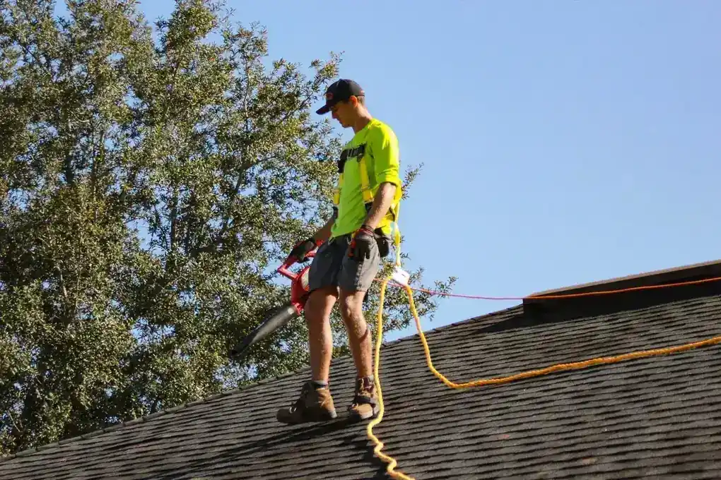 IWD Miami estimator performing on-site assessment for asphalt shingle roofing project