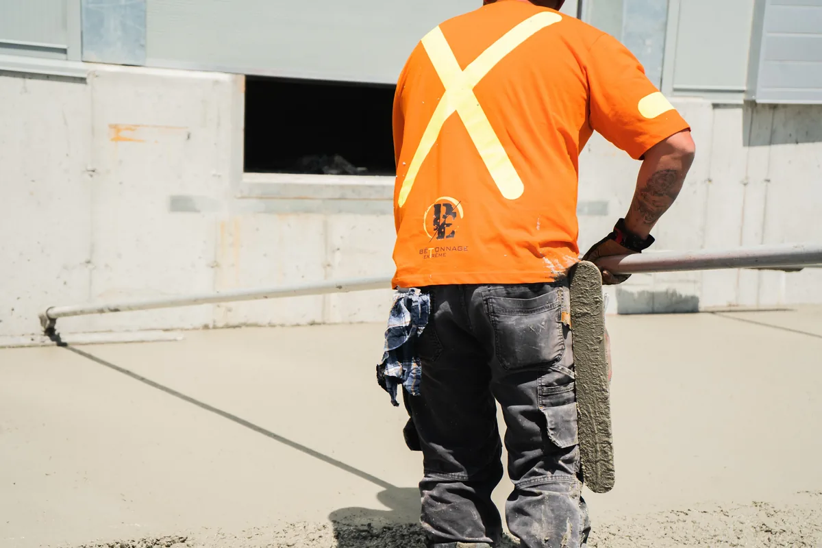 IWD Miami estimator performing on-site assessment for flat roofing project