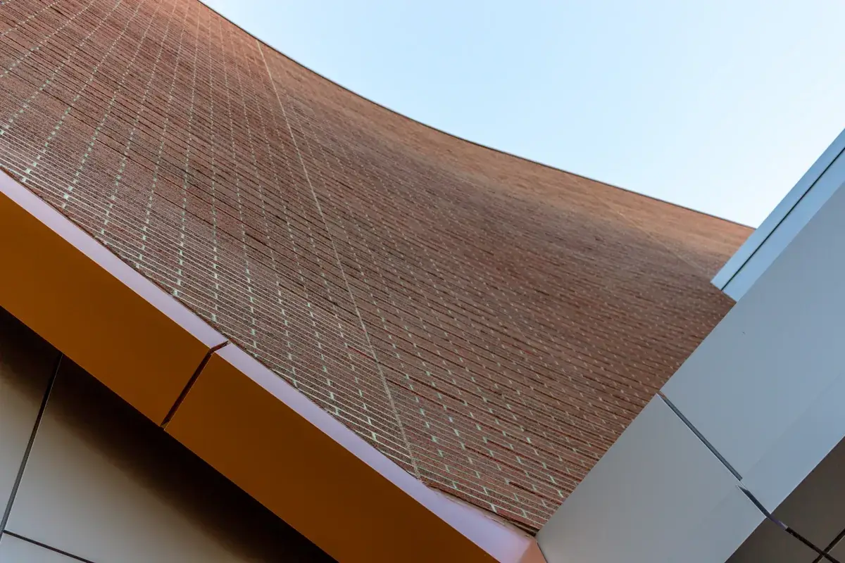Roofer installing architectural shingles on a Florida home