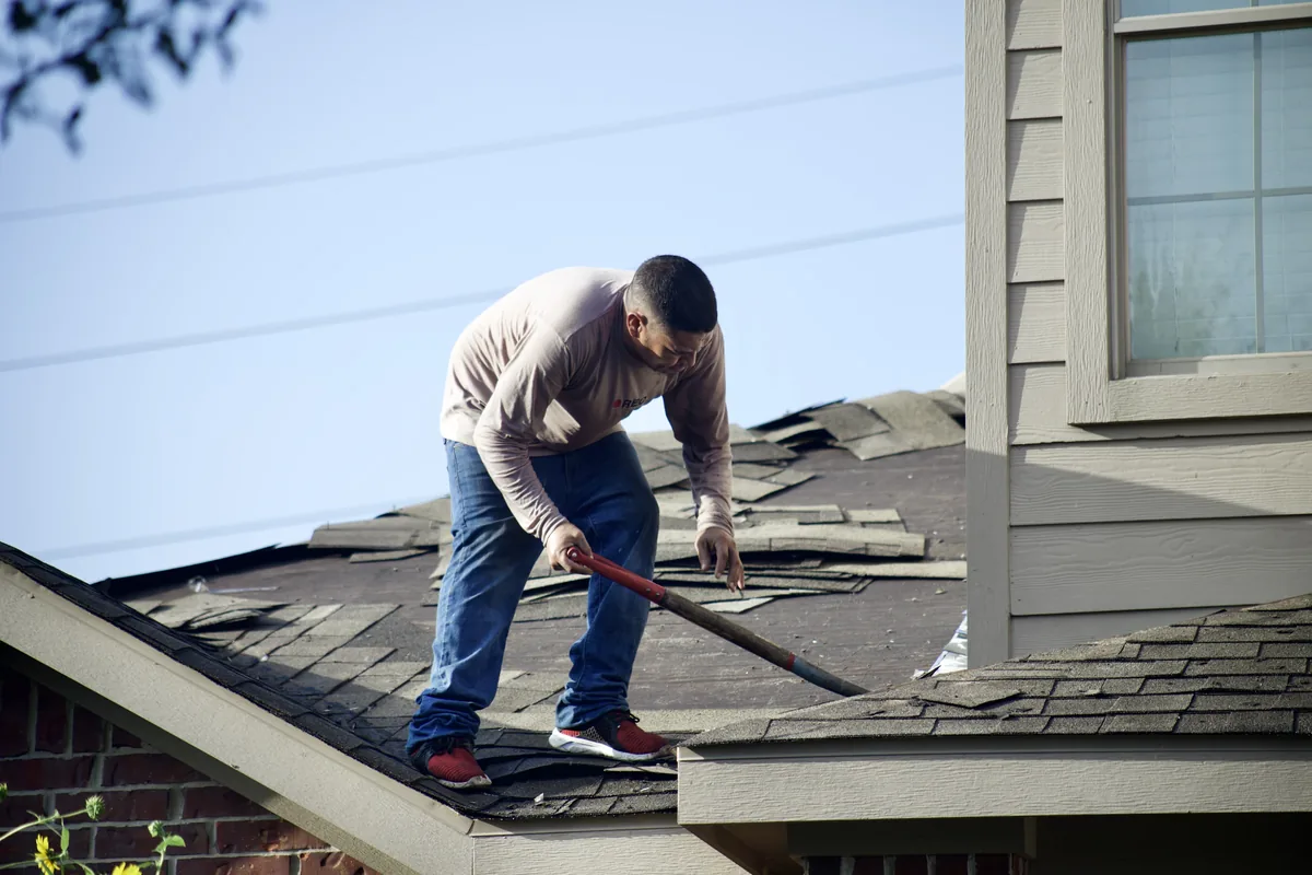 IWD Miami estimator performing on-site assessment for roof inspection project