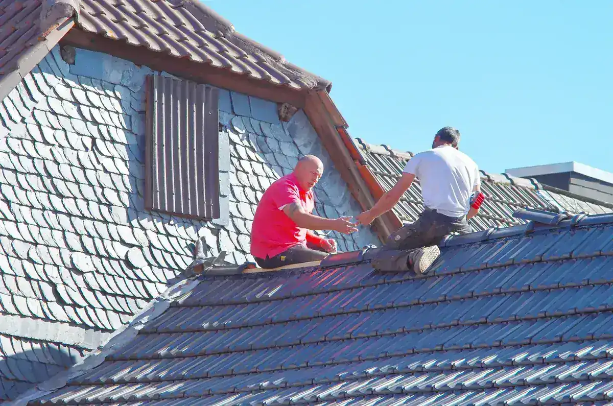 IWD Miami estimator performing on-site assessment for roof leak repair project
