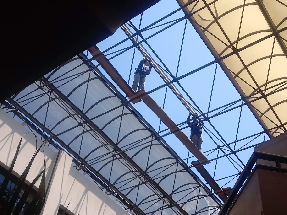 IWD Miami estimator performing on-site assessment for skylight installation project