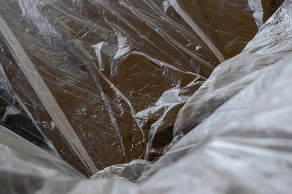 BPI-certified analyst performing crawl space insulation on a Florida home